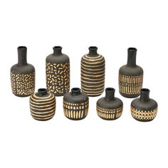 nine black and gold vases sitting next to each other