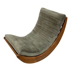 a wooden rocking chair with grey upholstered fabric on the back and seat cushion