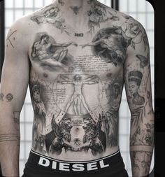 a man with many tattoos on his chest