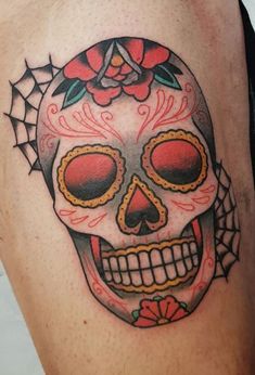 a skull with roses on it's head is shown in this tattoo style photo