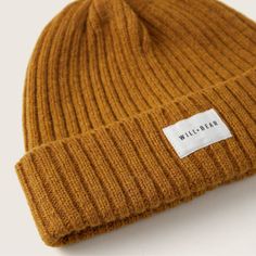 Stay warm this season with Levi Mustard, a unique beanie made of Renewable Australian wool with a warm fleece liner to keep your ears extra warm. Its mustard textured wool base is complimented by a stylish cotton logo banner, perfect for a vintage 70's look. Levi comes in one size fitting from 51cm-59cm. It is a firm fit and will stretch with wear. Affordable Beanie For Everyday Use, Cheap Cotton Beanie For Fall, Cheap Everyday Beanie For Fall, Cheap Warm Beanie For Fall, Cheap Warm Cotton Beanie, Affordable Adjustable Brown Beanie, Cheap Warm Solid Beanie, Mustard Wool Hat, Patagonia Beanie