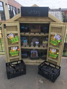 an outdoor writing area with lots of items in it