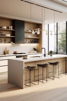 a large kitchen with lots of counter space and wooden cabinets, along with bar stools