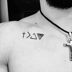 a man with a cross tattoo on his chest