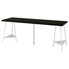 a black table with white legs on a white background