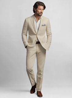 To look your smartest even on those hot days, all you need is to invest in our Sand Feather Cotton Canvas Stretch Suit. Crafted from cotton and lycra blend, the suit can be worn whenever you are ready to kick your stylish charm up a notch with great enthusiasm. Wear it at a wedding party or any special occasion. 
 
 Look Includes  Sand Feather Cotton Canvas Stretch Fabric  Two Button Jacket Style  Notch Lapel  Corozo Beige Buttons  Single Vent  Three Cuff Buttons  Two Welted Back Pockets on Trousers   You can change the look during customization if required. 
 
Lining: Viscose; Dry Clean. Tailored Summer Suits For Business Casual, Business Casual Notch Lapel Suits For Summer, Summer Business Casual Suits With Notch Lapel, Tailored Summer Business Casual Suits, Summer Tailored Business Casual Suits, Classic Beige Semi-formal Sets, Fitted Cotton Formal Set, Chic Linen Business Suits, Fitted Cotton Sets For Formal Occasions