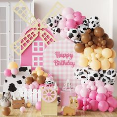 a birthday party with balloons and farm animals