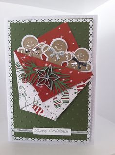 a christmas card with gingerbreads, holly and snowflakes on it's corner