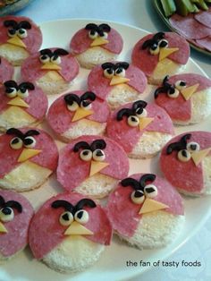 some kind of food that looks like birds on top of rice krispy kreme