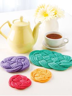 Unique kitchen accessories to make with scraps!   Have a little more yarn left to use? These coasters and trivets are a great way to put those bits and pieces to good use. Knit with approximately a total of 880 yds of DK-weight yarn at a gauge of 24 ... Knitted Coasters, Knit Coaster, Spool Knitting, French Knitting, I Cord, Dk Weight Yarn, Beautiful Knitting, Knit Or Crochet, Knit Pattern