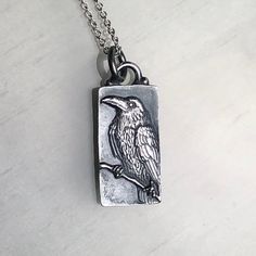 "This wonderful perched Raven was hand carved in wax by Carrie with the aid of a microscope. It was then cast in Sterling Silver and given a dark patina to help show off every feather. The pendant measures 1 1/4\" x 1/2\" and hangs on an 18\" sterling silver chain. Enjoy!" Raven Jewelry, Raven Pendant, Raven Necklace, Piercing Inspo, Precious Metal Clay, Owl Pendant, Message Jewelry, Scottsdale Az, Metal Clay