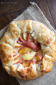 an apple pie on a piece of burlcloth