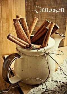 cinnamon sticks in a mug on a table