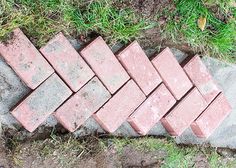 bricks laid out on the ground to be used for landscaping