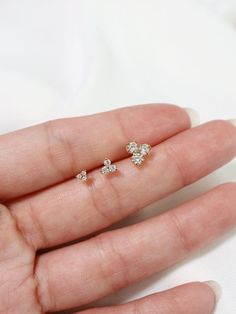 Tiny trefoil stud earrings in 3 sizes, micro, tiny and little! Sold as a SINGLE (choose options above).  PAIRS available here: https://www.etsy.com/listing/827255104/An everyday staple for the modern minimalist.  Hand set faceted cubic zirconia.  Butterfly backings.  Packaged in a beautiful gift box.Perfect for standard lobe piercings and small enough to be great stacking pieces for 2nd and 3rd piercings.***NOTE: the claws holding the stone for the LITTLE size are slightly different and don't ha Dainty Hypoallergenic Piercings, Hypoallergenic Dainty Piercings, Tiny Cubic Zirconia Minimalist Cartilage Earrings, Delicate 14k Gold Cartilage Earrings, Tiny Dainty Cubic Zirconia Piercings, Delicate Tiny 14k Gold Cartilage Earrings, Tiny Dainty Cartilage Earrings, 3rd Piercings, Cone Designs