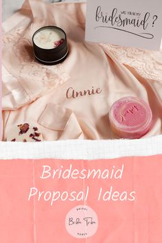 the bridesmaid's personal items are laid out on pink satin