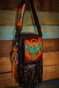 THIS BAG IS MADE TO ORDER This unique bag, was handmade from my favorite quality, oil-tanned, crazy-horse leather, and lined with heavy canvas. This bag is durable and amazingly functional at the same time. The front flap and matching shoulder-piece were hand tooled, dyed, and inlaid with 2 gorgeous labradorite gemstones! It features a large zippered front pocket, a zippered back pocket, and large main pouch with another small zippered pocket, and un-zippered small compartment. This bag also com Hand Painted Leather Crossbody Bag, Leather Hand Painted Crossbody Bag, Hand-painted Leather Tote Shoulder Bag, Hand Painted Leather Tote Shoulder Bag, Handmade Leather Festival Bag, Leather Satchel Saddle Bag For Festivals, Artisan Leather Festival Bags, Bohemian Hand Painted Shoulder Bag For Everyday Use, Hand Tooled Leather Bags For Festival