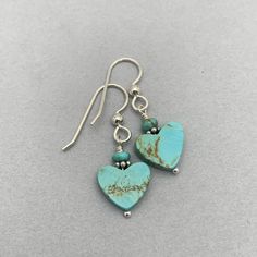 Pretty heart-shaped Kingman turquoise earrings. The genuine turquoise hearts have a beautiful blue-green color with light brown matrix. All metal is solid 925 sterling silver.  The earrings are ready for shipping and will be shipped within 24-72 hours from purchase. You will receive the earrings in a gift box with a ribbon. -------- FREE silver polishing cloth is included with all orders of $20 or more. Elegant Turquoise Heart Earrings, Turquoise Heart-shaped Sterling Silver Earrings, Green Heart Sterling Silver Earrings, Turquoise Heart Drop Earrings As Gift, Turquoise Heart Beads Dangle Earrings, Turquoise Dangle Earrings With Heart Beads, Blue Heart-shaped Sterling Silver Earrings, Blue Sterling Silver Heart Dangle Earrings, Blue Sterling Silver Nickel-free Heart Earrings