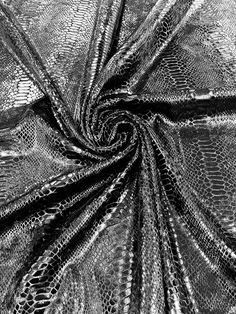 black and white photograph of snake skin fabric