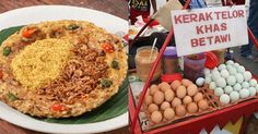 there are eggs, rice and other food items on the table at this outdoor market