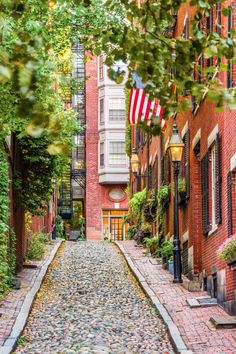 a cobblestone street with an american flag on it