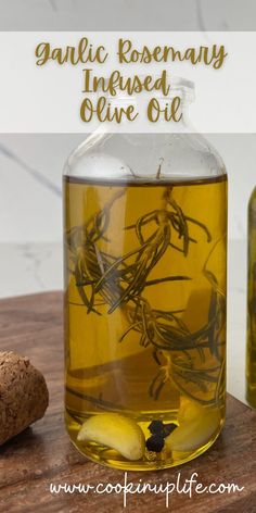 a glass jar filled with olive oil next to two corks