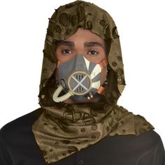 Get dressed for post-apocalyptic action in a gaming head mask! The cowl-like fabric costume accessory is camo green with darker distressed accents and a detailed gas mask on the front. You're ready for cosplay or dress-up in this soft hood. Gaming Post-Apocalyptic Gas Mask product details:  5in wide x 5in tall Does not include shirt One size fits most teens and adults Post-apocalyptic Halloween Masks And Prosthetics, Post-apocalyptic Masks And Prosthetics For Halloween Cosplay, Post-apocalyptic Masks For Cosplay Events, Post-apocalyptic Mask For Costumes, Post-apocalyptic Costume Accessories For Halloween Cosplay, Post-apocalyptic Halloween Cosplay Masks, Post-apocalyptic Masks For Halloween Costume Party, Post-apocalyptic Halloween Masks For Costume Party, Post-apocalyptic Masks And Prosthetics For Halloween