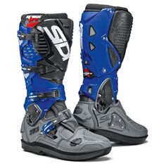 a pair of blue and grey motorcycle boots