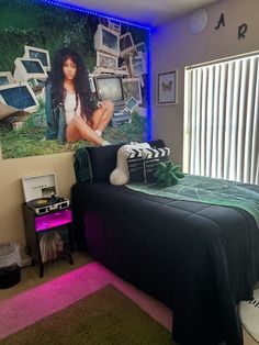 a bed room with a neatly made bed next to a large poster on the wall