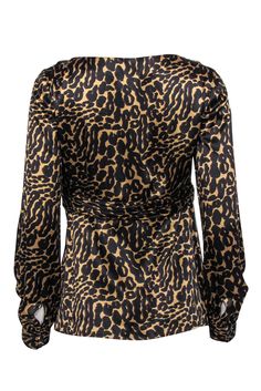 Go for some sexy satin and wild printed style with this sassy top from Tory Burch! Made with a plunge neckline and a bow accent, this sleek blouse will add some serious spunk to your favorite pencil skirts, dark jeans and so much more. Size 4 100% Silk V-neckline Front bow accent Long sleeve Satin texture Waist 30” Total length 25” Satin V-neck Party Blouse, Chic V-neck Top With Bold Print, Satin V-neck Blouse For Night Out, Leopard Print V-neck Tops For Night Out, Black Satin V-neck Blouse, Elegant Leopard Print Party Blouse, Elegant V-neck Leopard Print Top, Chic Blouse With Bold Print, Chic Leopard Print Blouse For Party