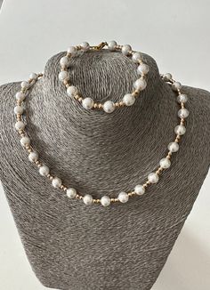 This is a handmade shell pearl necklace and bracelet set.  I have strung gorgeous 8 mm shell pearl beads  and gold tone hematite 3 mm beads together for a beautiful jewellery set.  These pearl beads are exquisitely shiny with a pure pearl finish.  The necklace is 44 cm in length and the bracelet is 20 cm in length. Both are fastened with gold tone lobster claw clasps.  Packed in an organza gift bag. Thank you for looking ! All items are made and shipped from Melbourne, Australia. Pearl And Gold Necklace, Beaded Necklace And Bracelet, Jewellery Elegant, Bridal Jewelry Pearl Sets, Ladies Jewellery, Agate Pendant Necklace, Necklace And Bracelet Set, Layered Necklace Set, Pearl Jewelry Sets