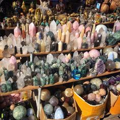 many different colored rocks and crystals on display