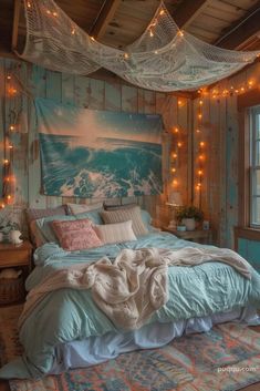 a bed in a room with string lights hanging from the ceiling and a painting on the wall