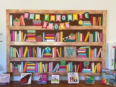 the children's bookshelf is filled with colorful books