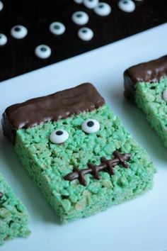 four green rice krispy treats with eyes and noses