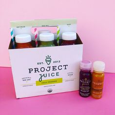 the project juice box is filled with different types of juices and condiments