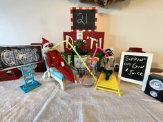 a table topped with lots of toys and signs