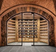 the inside of a wine cellar with glass doors