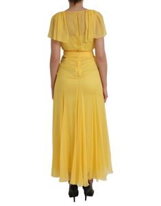 Dolce & Gabbana dresses are known for their elegant, sheer designs. This maxi dress features a zipper closure in the back and is made of 100% silk in a stunning yellow color. Made in Italy. Model: Maxi dress Color: Yellow Materials: 100% Silk Zipper closure Made in Italy Luxury Yellow Maxi Dress, Luxury Yellow Cotton Dress, Luxury Yellow V-neck Dress, Yellow Chiffon V-neck Maxi Dress, Luxury Yellow Maxi-length Gown, Dolce Gabbana Belt, Sheer Maxi Dress, Dolce Gabbana Dress, Long Maxi