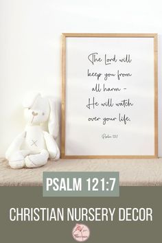 a white teddy bear sitting on top of a shelf next to a framed sign with the words, he lord will keep you from all whom