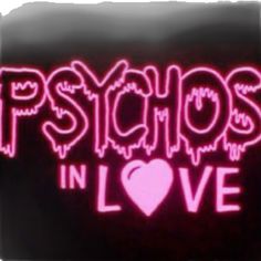 the words psychic in love are lit up with pink neon lights and hearts on black background