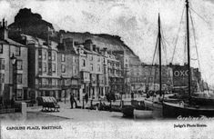 an old black and white photo of boats in the harbor