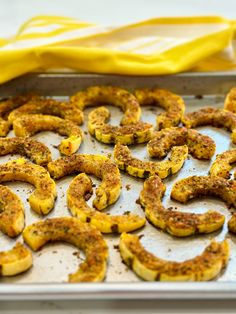 some food that is on a pan and ready to be cooked in the oven,