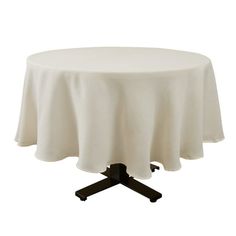 a round table with a white cloth on it