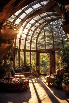 the sun shines through an arched glass window into a living room filled with furniture and potted plants