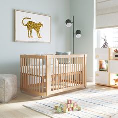 a baby's room with a wooden crib and toys