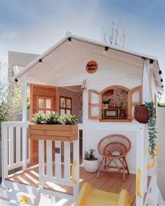 a doll house with wooden floors and white sidings on the front porch is shown