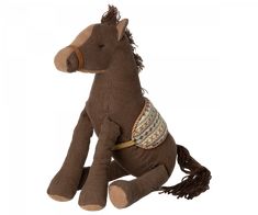 a brown stuffed horse sitting on top of a white floor