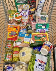 a shopping cart filled with lots of food