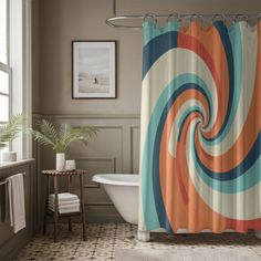 a bathroom with a bathtub, shower curtain and rug in the shape of a spiral